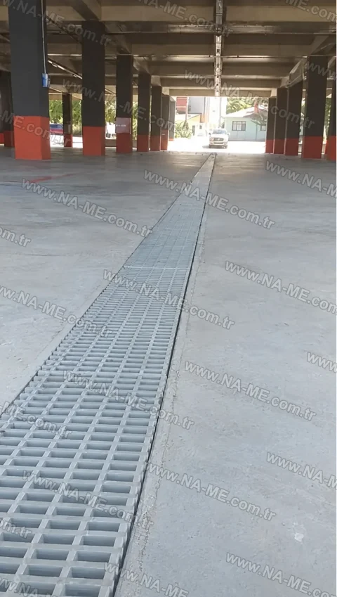 Traffic-rated trench grating in an open parking lot