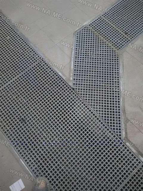 Angled trench grating at a mall entrance
