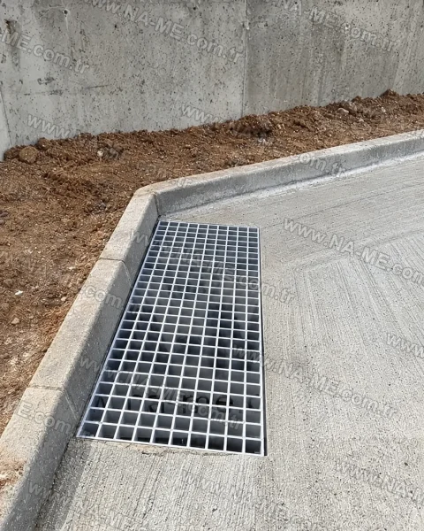 FRP grating in a concrete channel around a building