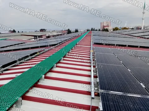 Walkway between panels at a rooftop solar plant