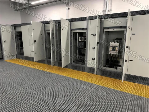 Safety grating floor in an electrical panel room