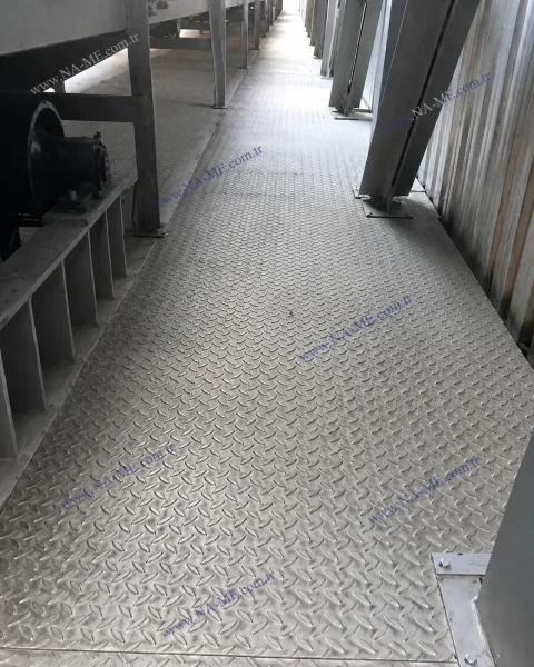 Solid-surface walkway along a conveyor line