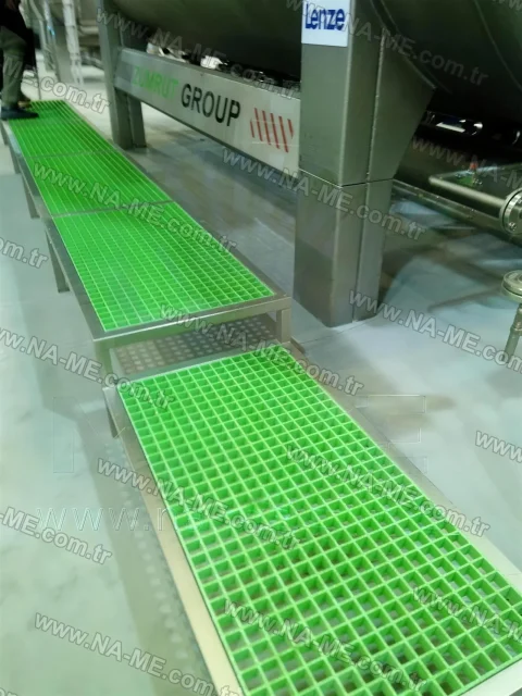 Green FRP walkway between process tanks