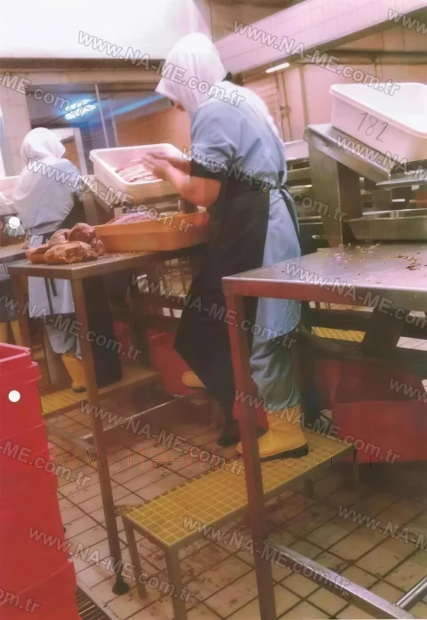 Yellow grating work platform on a food production line