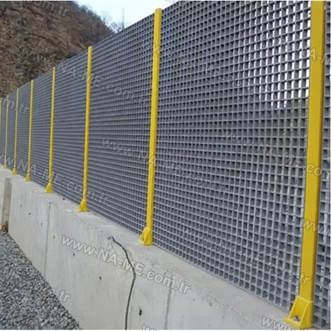 Post-mounted grating fence on a retaining wall