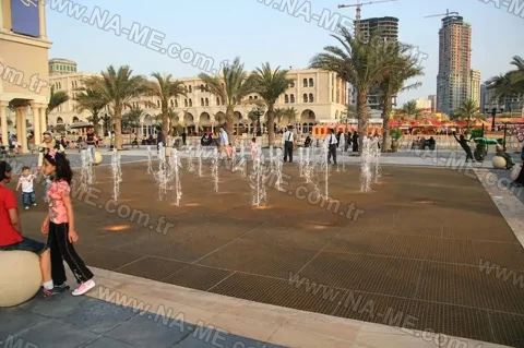 Wide grating decking in a city square ornamental pool