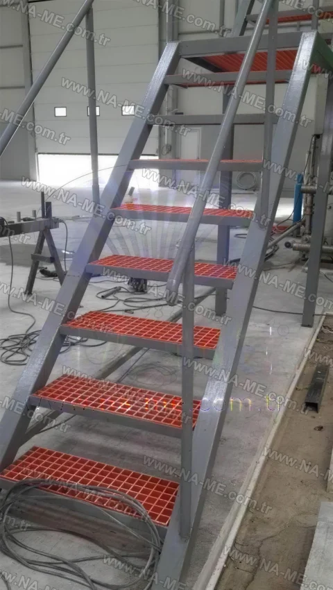 Red grating stair treads inside a factory