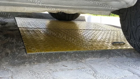 FRP manhole cover under a vehicle wheel
