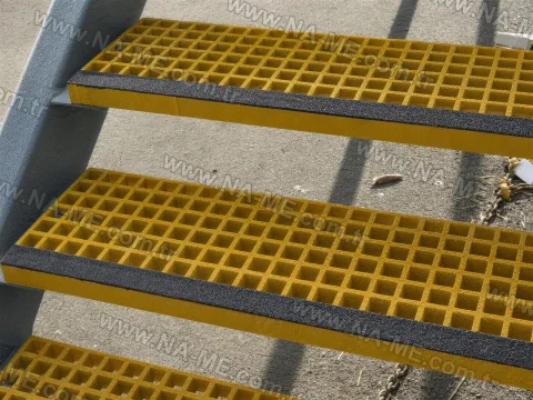 Anti-slip FRP stair treads with a sanded surface