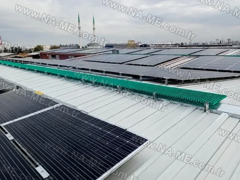 Service walkway along solar panels on an industrial roof