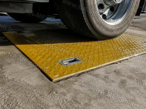 Yellow FRP cover under a vehicle load