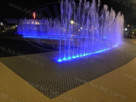 FRP grating floor in a lit ornamental pool at night