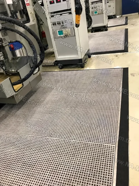 Grating floor around production machinery