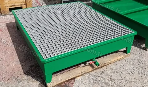 Grating spill containment pallet in a drum storage area