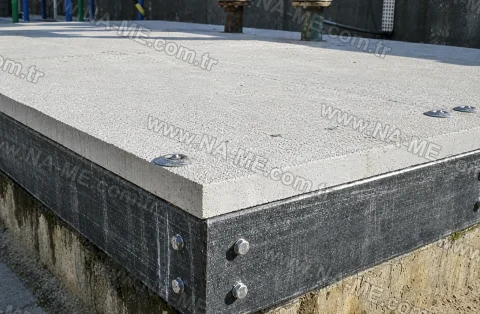 Large bolted FRP cover on a concrete chamber