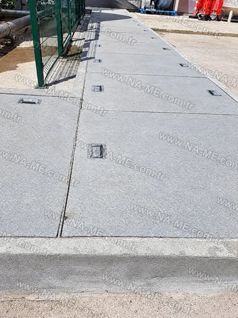 Cable trench covers running along a building